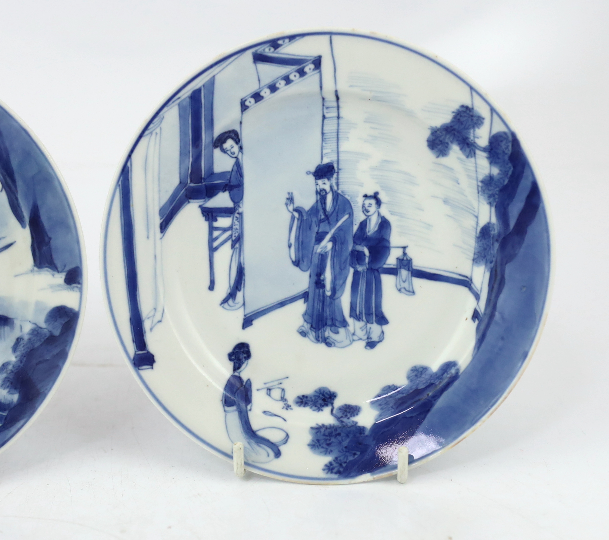 A pair of Chinese blue and white small plates, Kangxi period, hairline cracks to one plate.